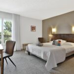 Double bedroom, Hotel Le Tropicana in Dordogne, France